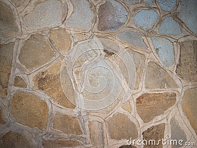 Decorated stone wall in the garden of a house in italy Stock Photo