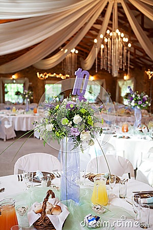 Decorated tables with candelabra at wedding reception, selective Stock Photo