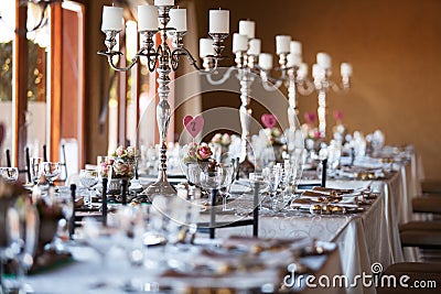 Decorated tables with candelabra at wedding reception, selective Stock Photo