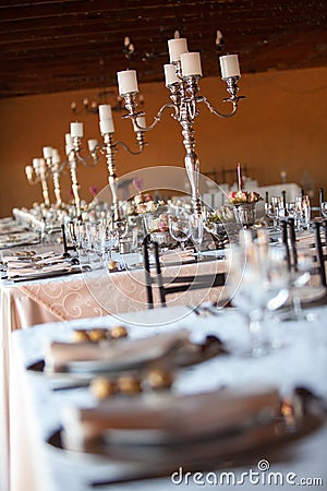 Decorated tables at indoors wedding reception. Selective focus Stock Photo