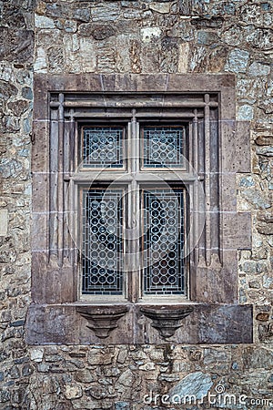 Decorated vintage window of an old stone building Editorial Stock Photo