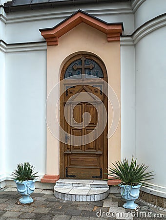 Decorated wooden front door of the church in Serbia Stock Photo