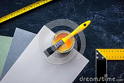 Decorating and house renovation tools and accessories on black stone table background top view mockup Stock Photo