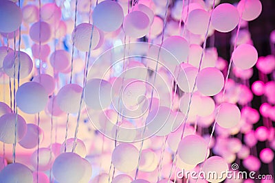 Decorating light white pink color hanging polystyrene plastic ball sphere curtain on outdoor stage setting. Abstract, Background, Stock Photo