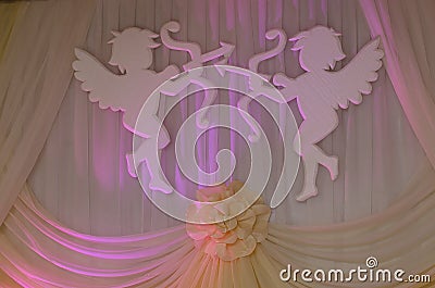 Decoration, big angels, cupids on the wall Stock Photo