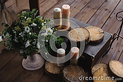 Decoration with candles and flowers on a dark wooden background Stock Photo