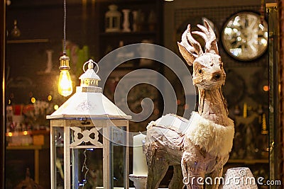 Decoration figurine wooden deer and lamp. home decor holiday Stock Photo