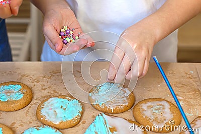 Decoration of ginger cookies on a wooden table. sprinkle on cookies. cooking Stock Photo