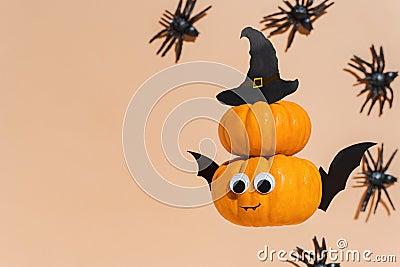 Decoration for Halloween kids party - flying cute pumpkin head with eyes and funny face. Pumpkin monster, witch, vampire, crawling Stock Photo