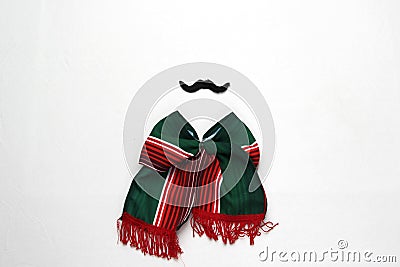 Decoration for Mexican party: tricolor tie bow, mustache, pinwheels, handmade doll with the colors of the Mexican flag green, whit Stock Photo