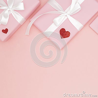 Decoration valentine`s day on table top view background. Flat lay composition of heart and pink gift box coral paper background Stock Photo