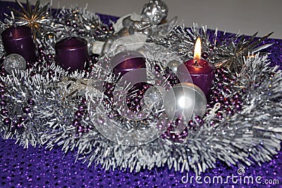 First sunday in advent concept xmas light with candles ball bauble stars.Studio shot of a nice advent wreath with baubles and burn Stock Photo