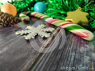 Decorations. New Year decoration. Green rain, Christmas balls, stars, candy and gifts. Christmas mood. Signature space Stock Photo