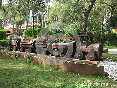 Decorations in park with flowers growing in wooden train Stock Photo