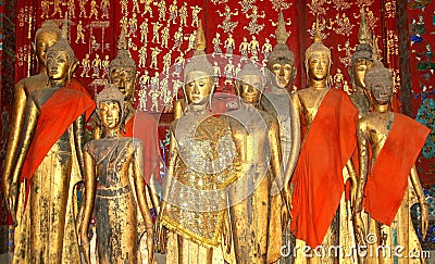 Ancient Buddha statues in Unesco temple Wat Xieng Thong, Luang Prabang, Laos Stock Photo