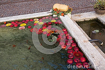 decorations in a village - a by red apples nice decorated village well in South Tirolia Stock Photo