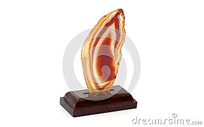 Decorative agate slice with wooden stand isolated on white background Stock Photo