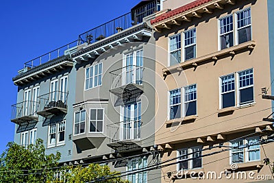 Decorative apartment complex buildings in downtown san francisco historic districts with metal balconies and windows Stock Photo