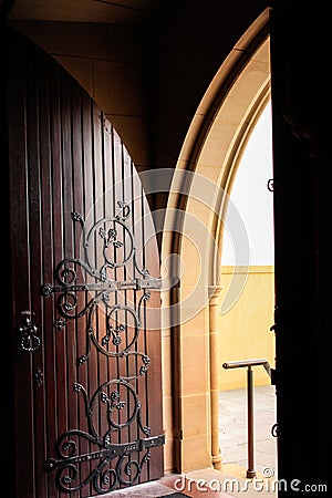 Decorative arched wooden church door Stock Photo