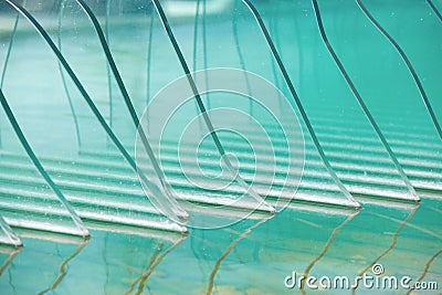 Decorative beveled and tempered glasses in an ornamental pool Stock Photo