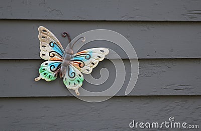 Decorative butterfly adorning outside wall of home Stock Photo