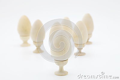 Christian Easter.Many wooden eggs for coloring stand on stands. Stock Photo