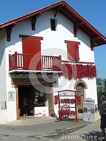 Decorative chili peppers decorating house in Village in French P Editorial Stock Photo