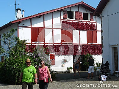 Decorative chili peppers decorating house in Village in French P Editorial Stock Photo