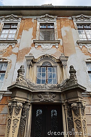 Decorative classicistic house gate on old decaying historical town house in Esztergom, Hungary Stock Photo