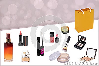 Decorative composition of feminine beauty products. Set of make up brushes, liquid make-up pillow, skin care products, eye shadows Stock Photo