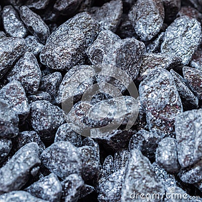 Decorative dark pebbles, like coal, close-up, background, texture. For modern abstract pattern, wallpaper or banner Stock Photo