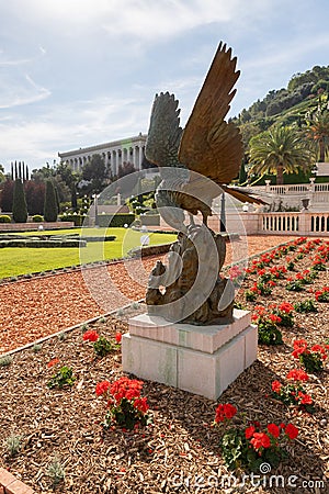 A decorative eagle cast in bronze stands on a pedestal in the Bahai Garden, located on Mount Carmel in the city of Haifa, in Editorial Stock Photo