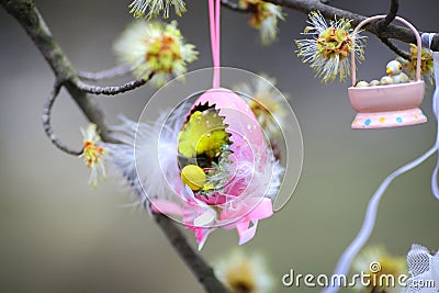 Decorative easter egg of pink color on a tree Stock Photo