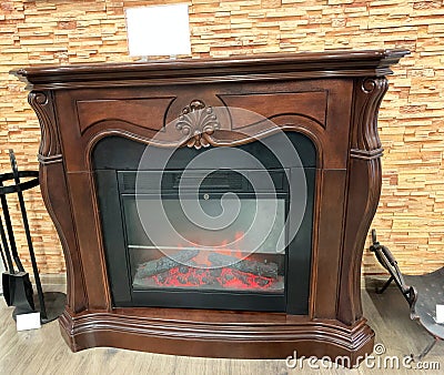 Decorative electric fireplace, brown. Stock Photo