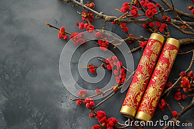 Decorative firecracker with background of ginkgo branch in chinese new year. Lunar New Year holidays Stock Photo