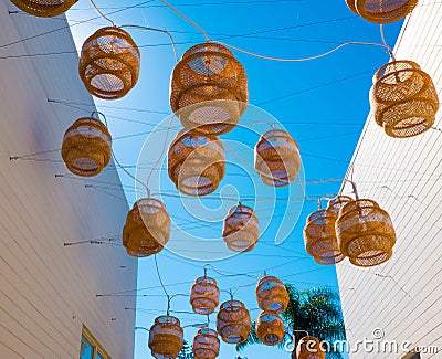 Decorative Floating lanterns hang above an alleyway in Malibu. Stock Photo