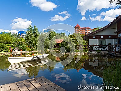 Decorative flowerbed boat in the plant park. Landscaping Editorial Stock Photo