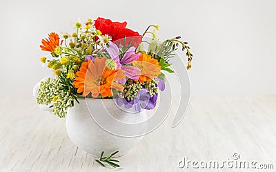 Decorative flowers in a white vase Stock Photo