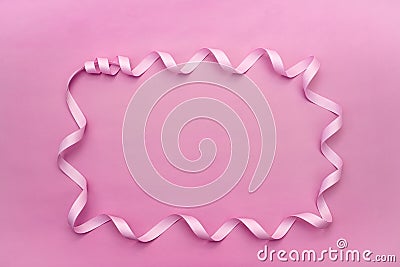 Decorative frame made of a satin ribbon rose. Stock Photo