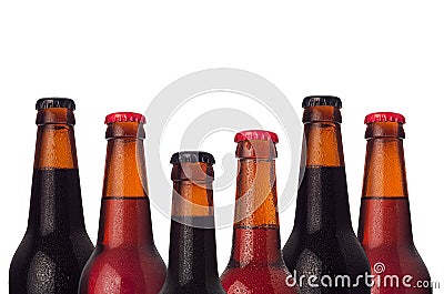 Decorative frame of set head beers bottles with porter, ale, lager beer and water drops isolated on white background. Stock Photo