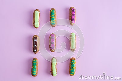 Decorative French eclairs organised in rows. Stock Photo
