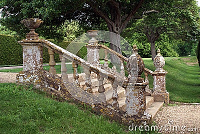 Decorative garden steps with a balustrade, urns, & globes. Stock Photo