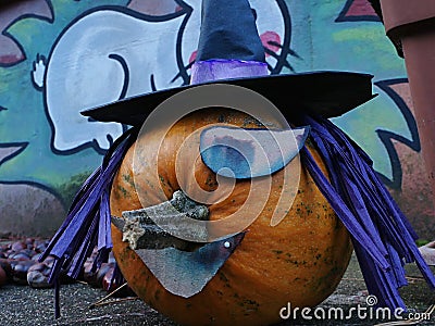 Decorative halloween full jack-o-lantern pumpkin styliyzed as one eyed witch Stock Photo