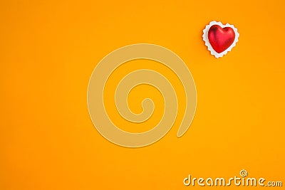 Decorative heart on a bright orange background Stock Photo