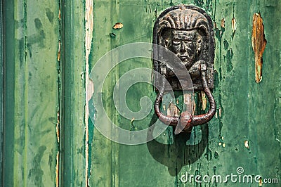 Decorative human head door knob. Brass door knocker Stock Photo