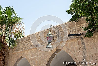 A decorative lamp hangs in the courtyard in the Muslim shrine - the complex of the grave of the prophet Moses in the old Muslim Stock Photo