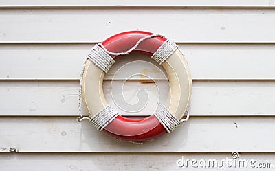 Decorative life preserver on rustic weather board wall Stock Photo