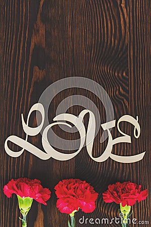 Decorative love text and carnations Stock Photo