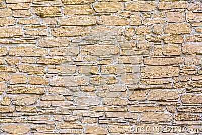 Decorative masonry of natural stone of different sizes. Stock Photo