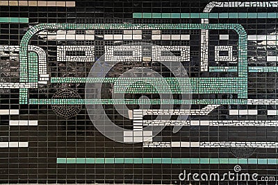 Decorative mosaic panel made of glossy ceramic tiles in the interior of the renovated bus station 